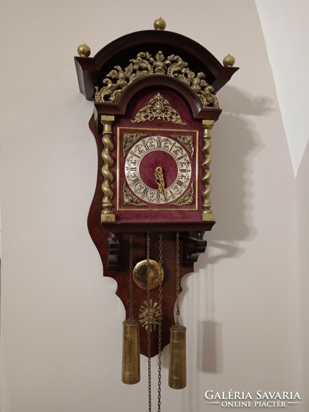 A rare, beautiful, half-baked pendulum Dutch wall clock. With copper columns, ornaments, Roman dial.