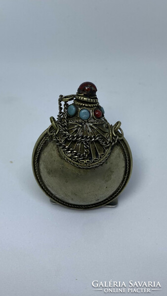 A small, antique snuff holder of Tibetan origin