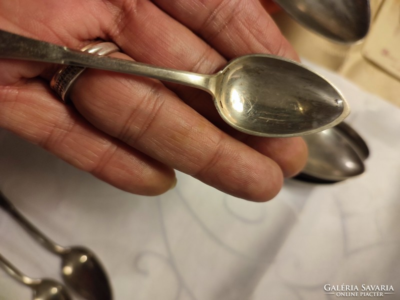 12 silver mocha spoons with dog heads
