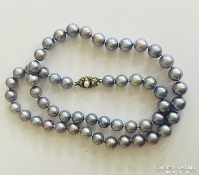 Elegant silver - blue string of pearls, decorative silver lock