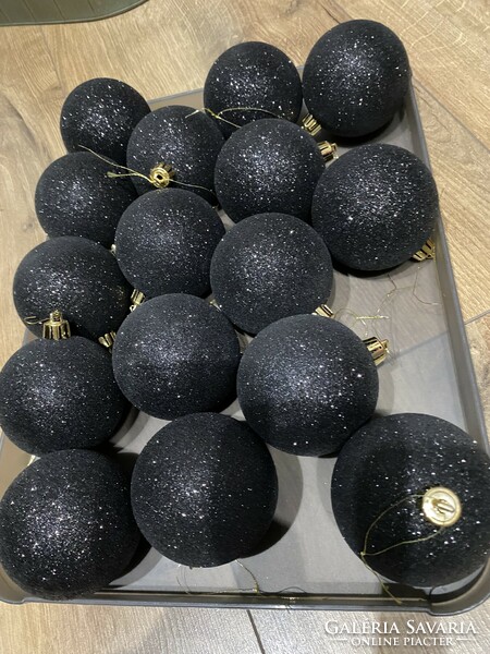Light, showy, shiny and flashing black plastic spheres