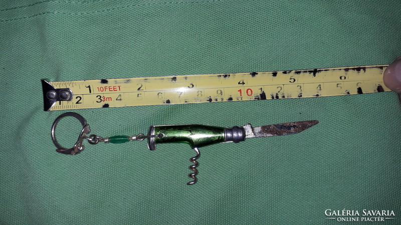 Retro tobacconist multi-functional mini knife keychain with green vinyl handle as shown in the pictures