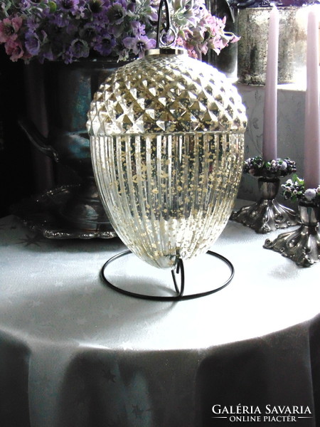 A huge glass acorn Christmas tree ornament with silver strings