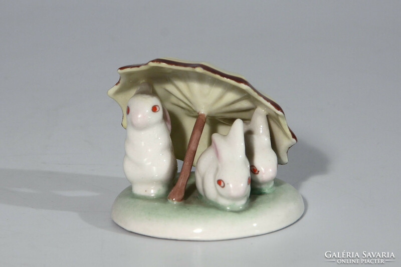 Drasche rabbits under a yellow umbrella | three rabbits
