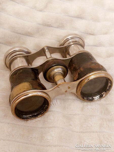 Theater copper telescope with leather coating.