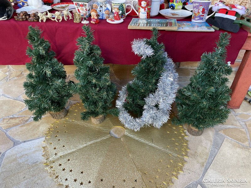 On a wooden base, artificial pine trees, pine trees, Christmas trees