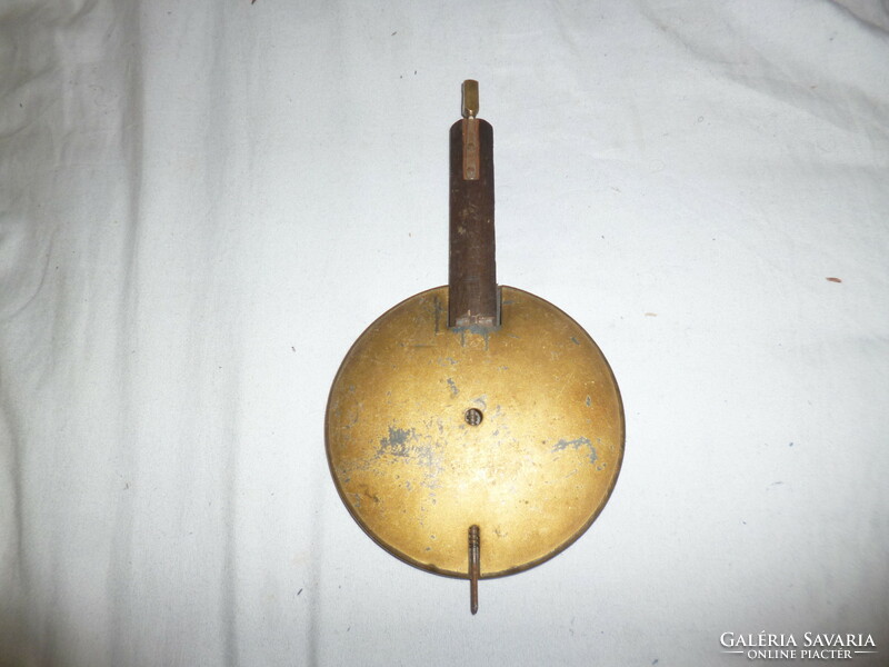 Old wall clock pendulum