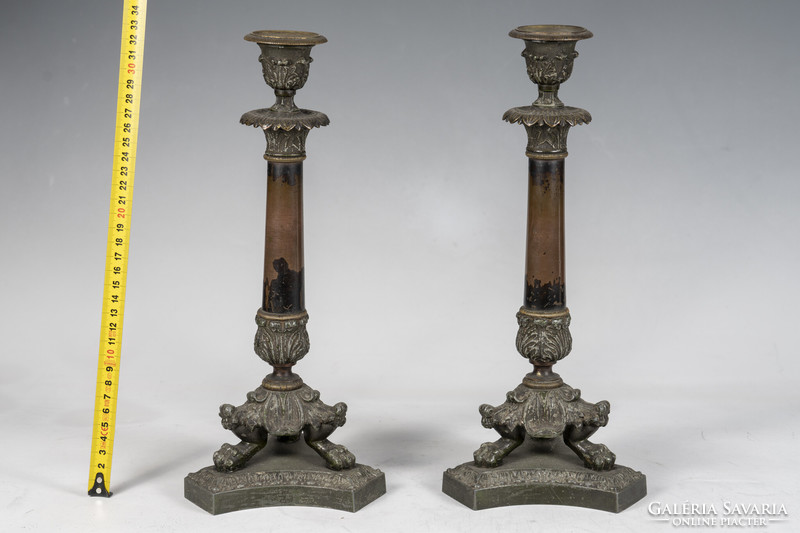 Pair of bronze candlesticks with stylized lion feet