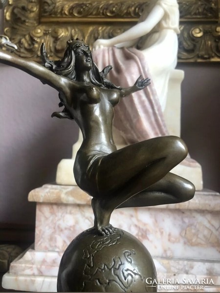 Female act with globe - bronze sculpture