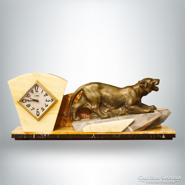 Art deco style fireplace clock made of stone with animal decoration