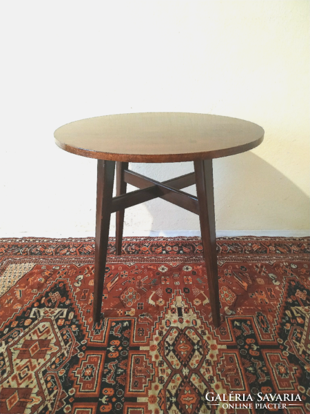 Old side table with a round top
