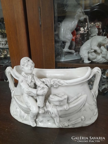 Old glazed ceramic boy scout boy in a boat with a figural bowl, centerpiece..24 Cm.