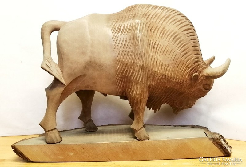 Fisting bison, full-figure carved natural wooden statue in impeccable condition