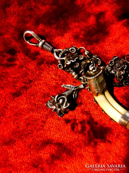 Silver hunting chain, mini trophies, dragon slaying St. George talisman, rock crystal, snow boots,