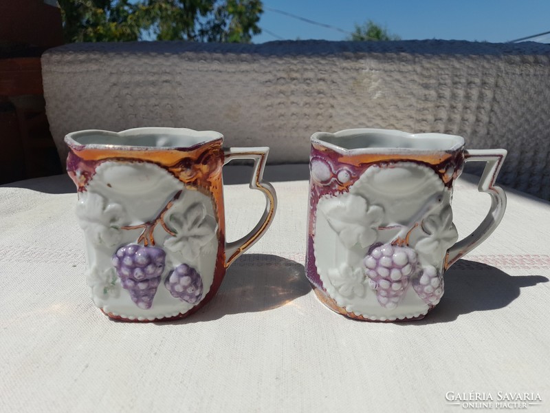 Art nouveau porcelain mug with grape relief pattern