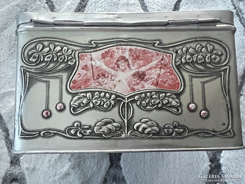 Beautiful art nouveau embossed metal box with a female portrait with violets