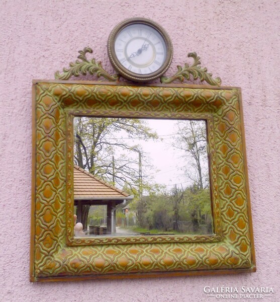 Wall mirror with clock in an antique cast iron frame, I recommend it for rustic interior design