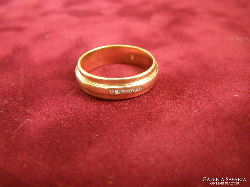 Women's gold stone wedding ring with 5 small diamonds