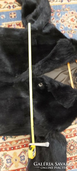 Black women's faux fur coat, slightly expanding downwards, photo