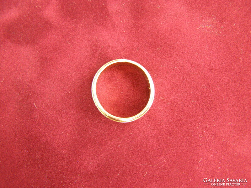Women's gold stone wedding ring with 5 small diamonds