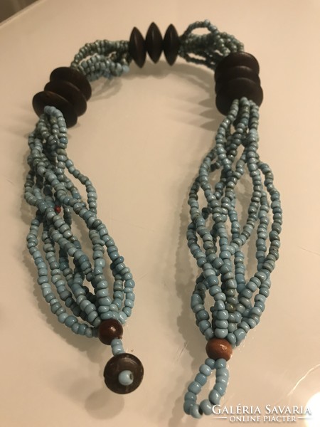 Necklace made of turquoise beads and exotic wooden discs