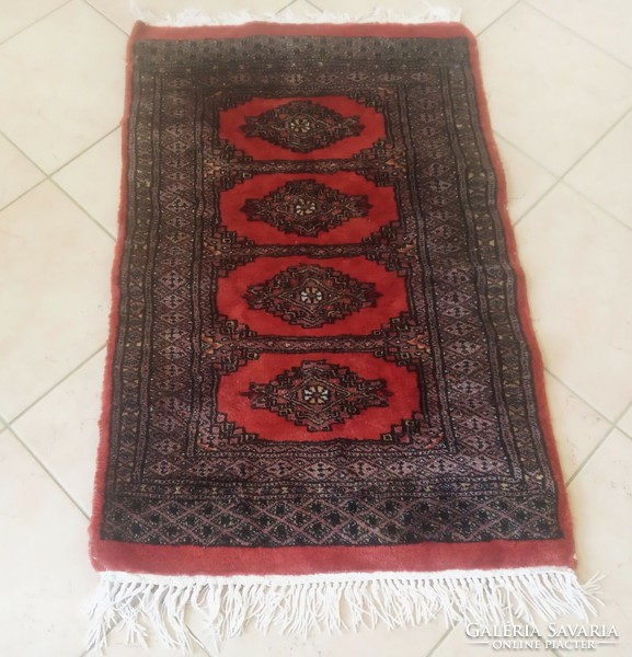 Persian carpet with Bochara pattern