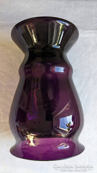 The amethyst purple glass vase is in perfect condition
