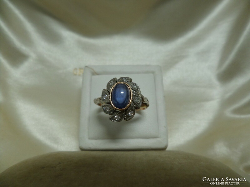 Antique gold crammed ring with synthetic sapphire and brills