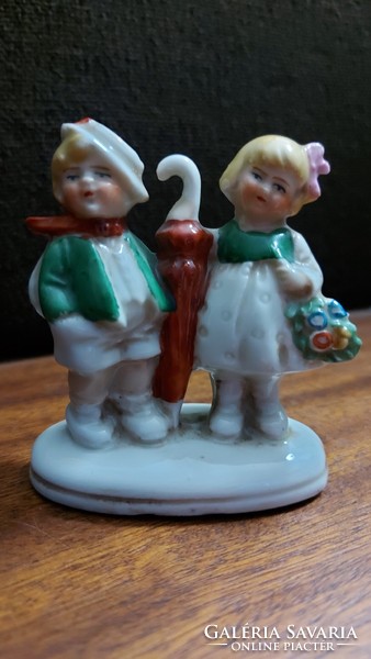 German porcelain doll with a pair of umbrellas