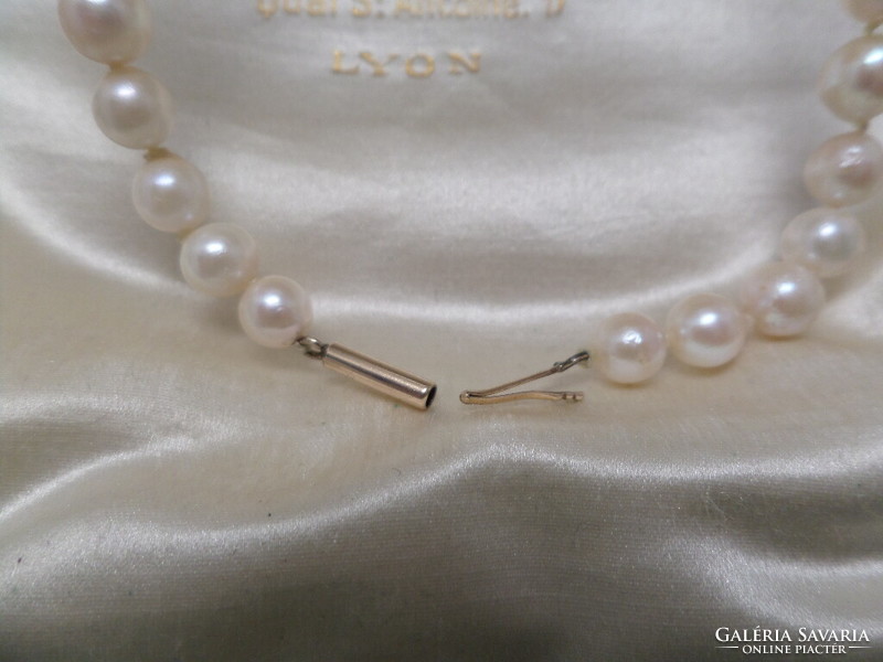 Genuine saltwater cultured pearl string with gold clasp
