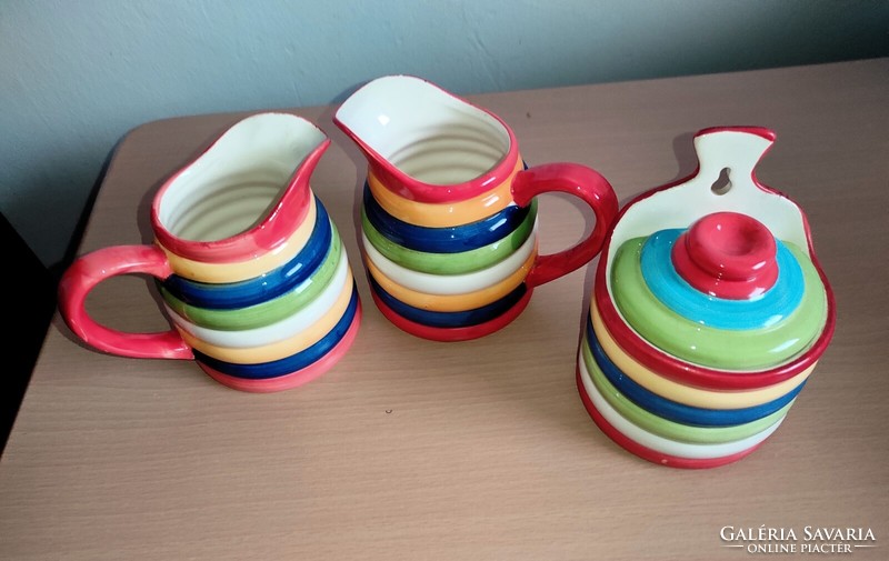 Very showy, cheerful colorful ceramic jugs and salt or sugar holder
