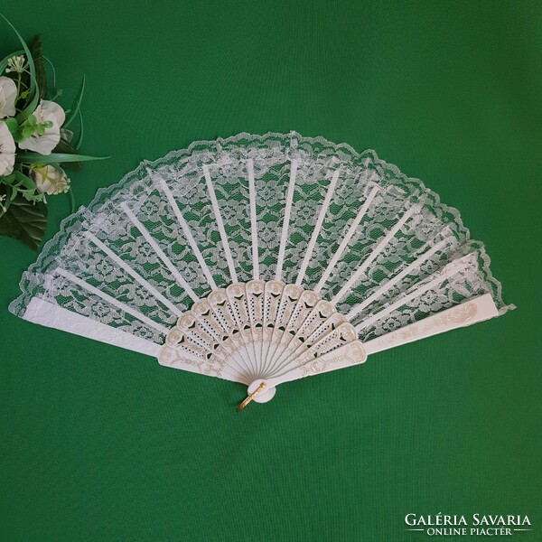 New, snow-white bridal lace fan