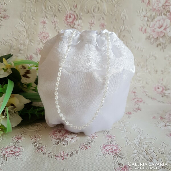 New, custom-made snow-white, lacy, satin bridal gown, small bag