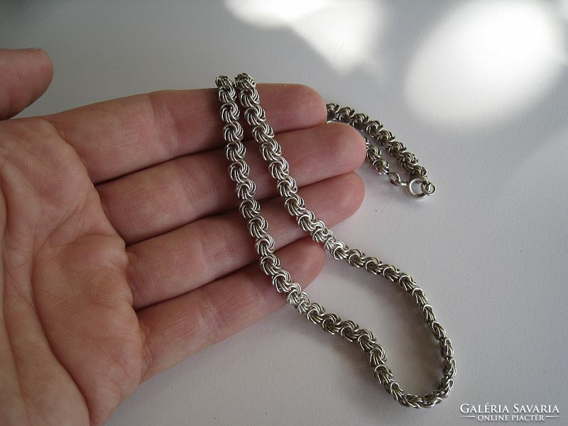 Old silver necklaces with rose braid