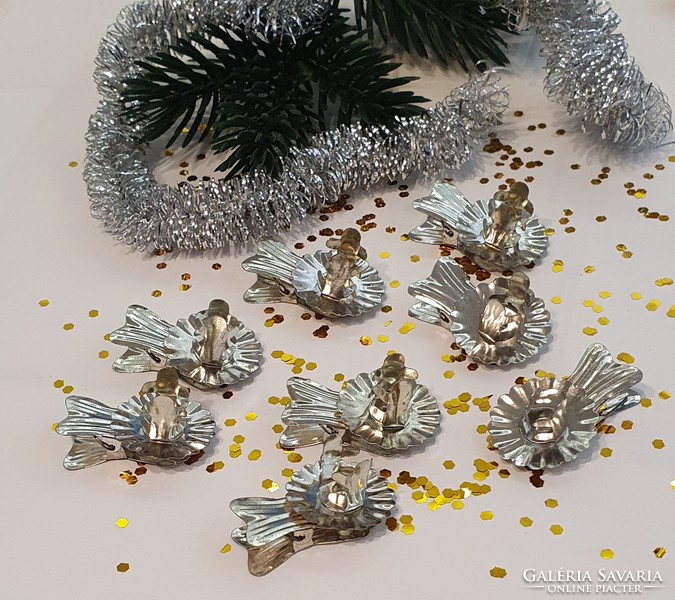 A package of old candle clips for a Christmas tree in new condition