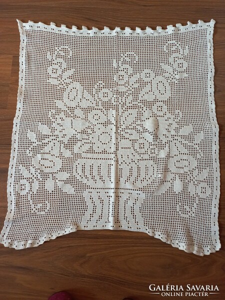 Snow-white, crocheted curtain
