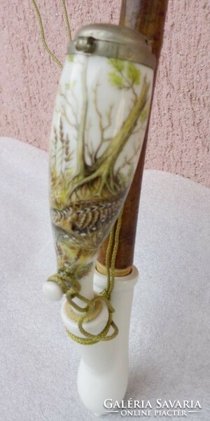 A giant wild scene porcelain pipe with an alpaca lid and a tufted cord. In perfect condition