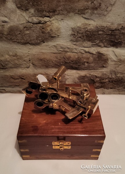 Brass sextant in a wooden box