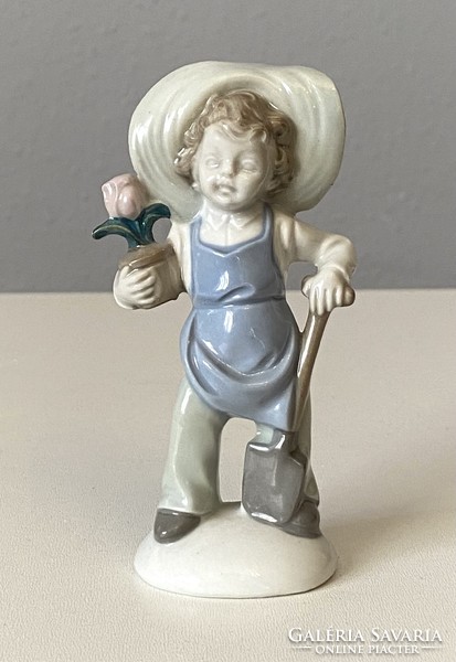 Gardener boy flower-painted German porcelain figurine 11 cm