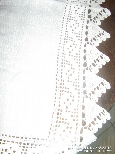 Beautiful white tablecloth with beautiful handmade crochet edges and inserts