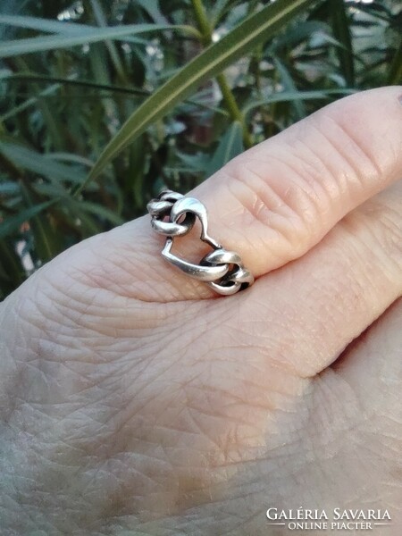 Silver ring with a heart pattern