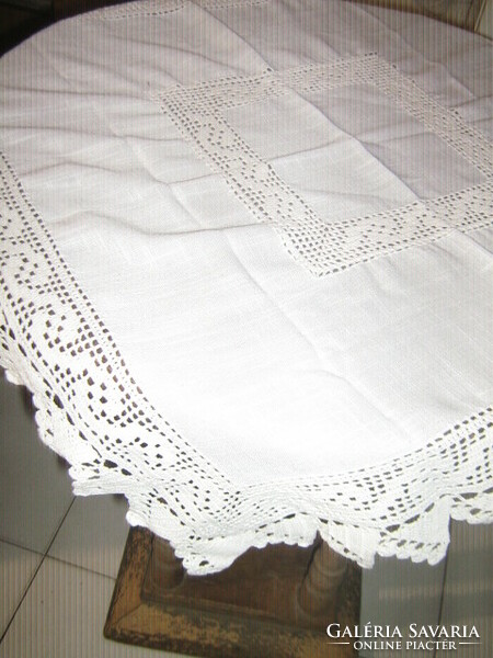 Beautiful white tablecloth with beautiful handmade crochet edges and inserts