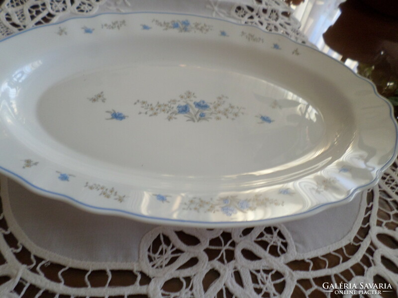Jena bowl made of oval milk glass with a blue flower pattern. Facepalm