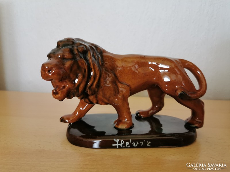 Porcelain brown glazed lion figure with heat water inscription
