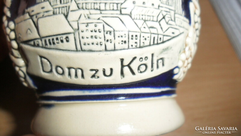 Beer mug with German embossed pattern. 11 cm high.