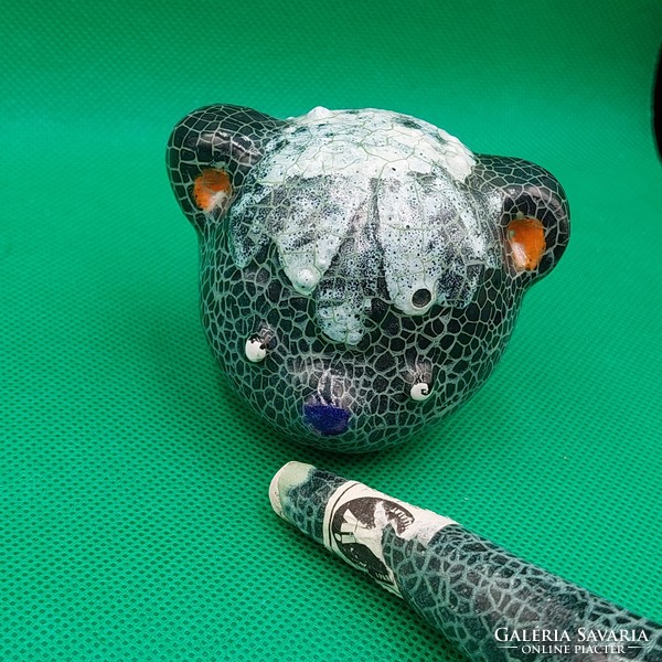 A rare collector's art ceramic gardener with a moving head bear figure