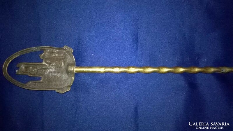 Perhaps a copper meat-picking fork - wall decoration