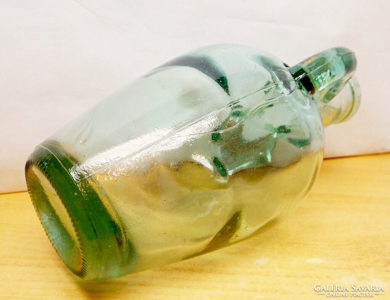 Antique amphora-shaped bottle with a molded ear with bubble inclusions