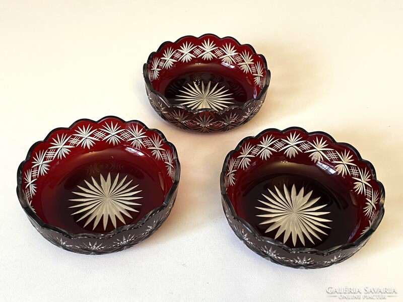 3 burgundy-colored incised crystal serving bowls with candied hazelnuts