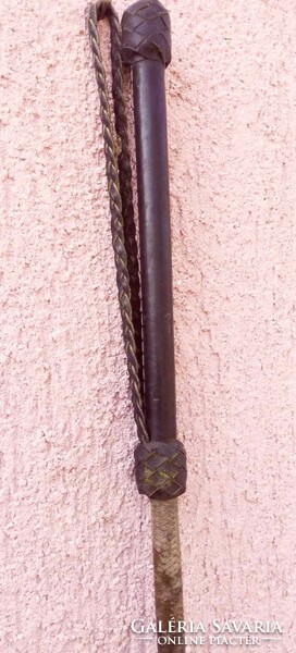 Leather braided riding whip in patina condition